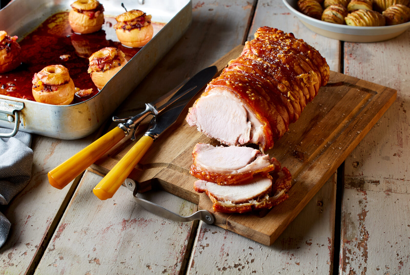 Roast pork loin served with mini stuffed baked apples - Porc Blasus